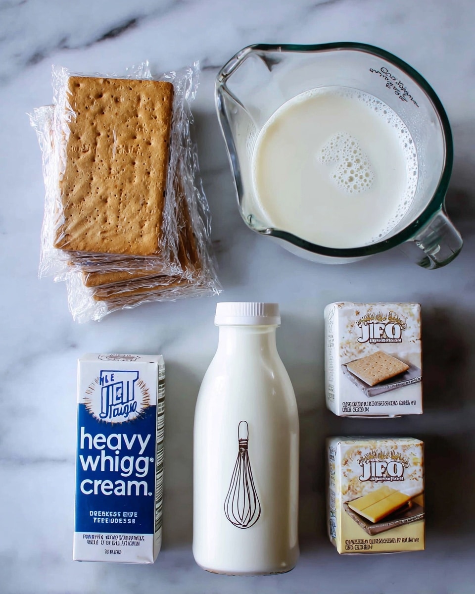 The image shows ingredients for a dessert arranged on a white marbled surface. On the left, there are three stacks of rectangular golden brown graham crackers wrapped in clear plastic with a slightly rough texture. To the right of the crackers, there is a small white bottle labeled “heavy whipping cream” with blue and black text and a simple whisk drawing. Above the bottle, there is a clear glass measuring cup filled with smooth white milk, showing gentle bubbles on top. To the right of the bottle, there are two small boxes of Jell-O pudding mix, one labeled cheesecake flavor with white and light yellow colors and the other vanilla flavor with white and soft beige colors. The whole setup has a clean and simple look. photo taken with an iphone --ar 4:5 --v 7