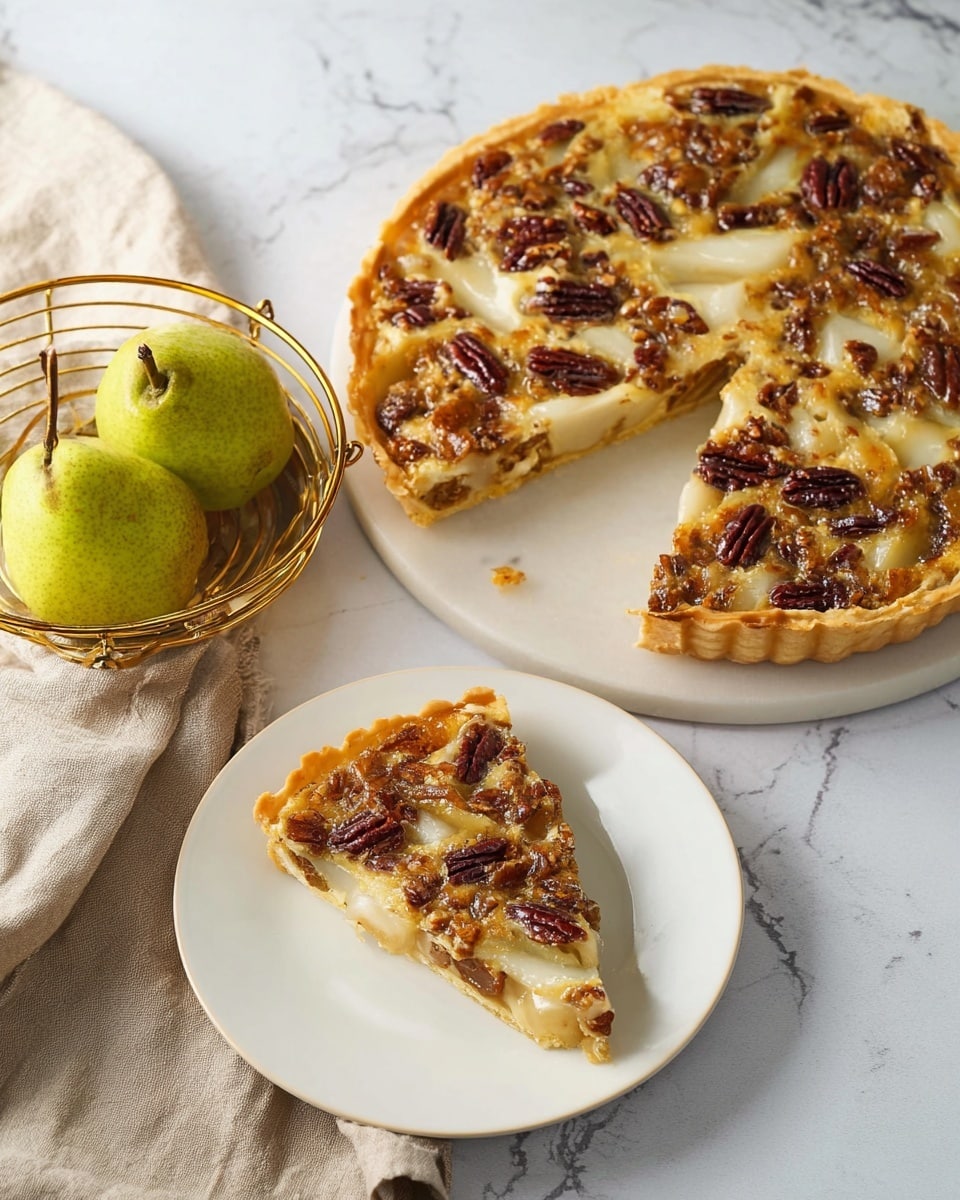 A round tart with a golden-brown crust filled with a caramel-colored pear filling, topped with melted light yellow cheese and scattered dark brown pecan halves. One slice is separated on a small white plate in the foreground showing the layers clearly: the crust, gooey pear filling with cheese, and pecans on top. Two green pears in a round golden wire basket and a folded beige cloth are placed nearby on a white marbled surface. The light shines softly, highlighting the texture of the tart and the pecans. Photo taken with an iphone --ar 4:5 --v 7