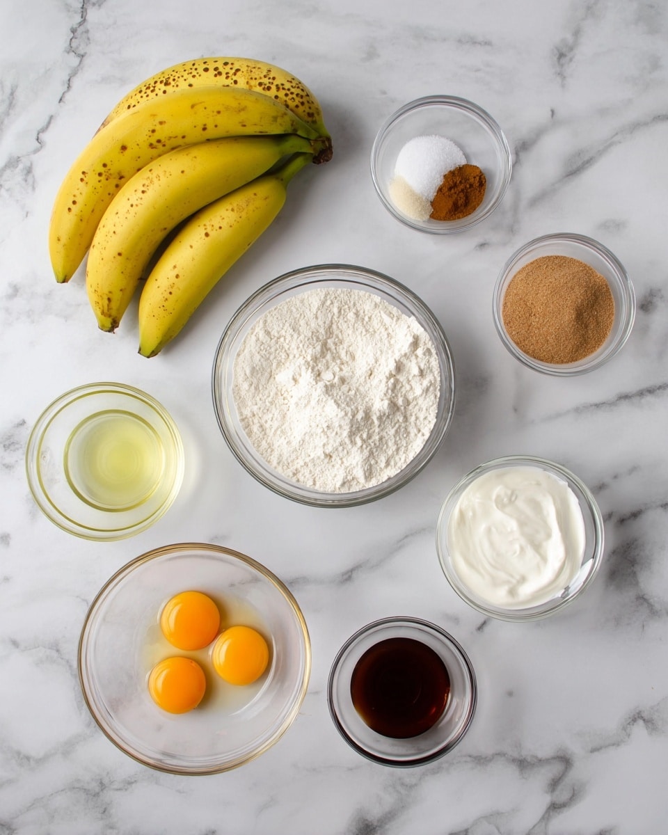 On a white marbled surface, there are seven clear glass bowls and one white bowl arranged neatly. At the top left, three bright yellow bananas with small brown spots rest together. To the right, there is a small clear bowl with white powder and two small brown spices, beside it is a medium clear bowl filled with light brown sugar. In the center is a white bowl full of white flour. Below the flour bowl and slightly to the left is a small clear bowl filled with a light yellow liquid, likely oil. Below that, a clear bowl containing two cracked eggs with bright orange yolks and translucent whites is placed. To the right of the eggs is a small clear bowl with dark brown vanilla extract. Just above the vanilla bowl is another small clear bowl filled with a thick white creamy substance. Photo taken with an iphone --ar 4:5 --v 7