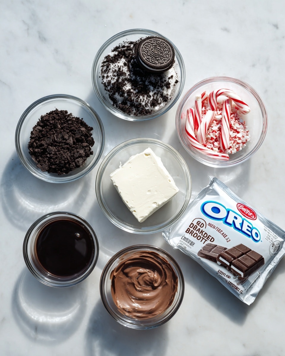 The image shows six clear glass bowls arranged on a white marbled surface, each containing different dessert ingredients. The top left bowl holds dark chocolate cookie crumbs with a whole Oreo cookie on top. To the right, a smaller bowl contains crushed red and white peppermint candy with two small candy canes. Below the cookie crumbs, a bowl has a block of white cream cheese, smooth and firm. At the bottom left, a bowl is filled with dark chocolate syrup, shiny and thick. Next to it, a bowl contains a creamy, smooth chocolate mixture with a rich brown color. On the right, a package of Oreo chocolate almond bark with white and blue labeling lies flat, adding a branded touch to the arrangement. Photo taken with an iphone --ar 4:5 --v 7