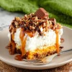 Snickers Poke Cake with Whipped Cream Frosting Recipe