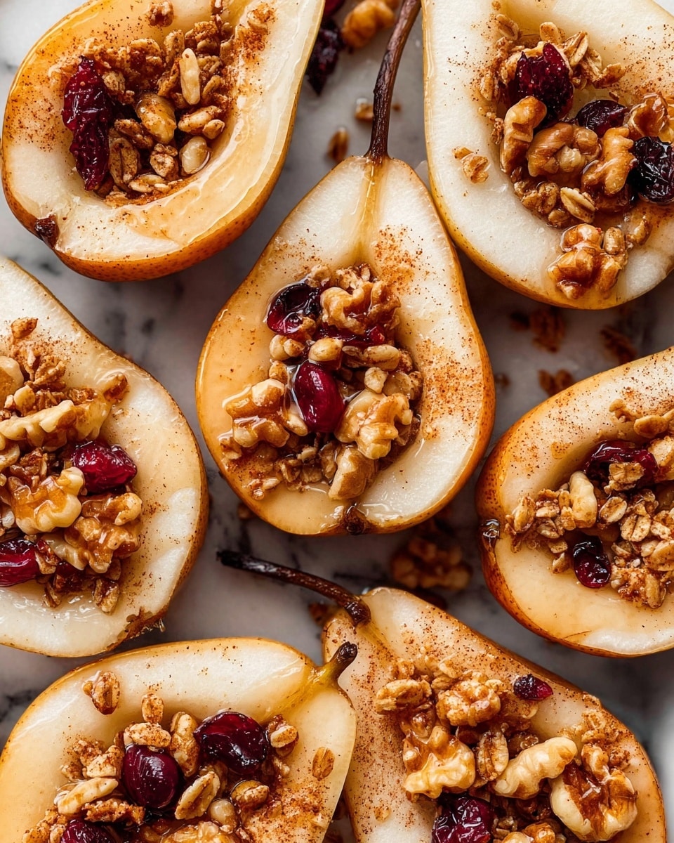 The image shows several halved pears arranged closely together on a white marbled surface. Each pear half is filled with a crunchy granola mixture that includes clusters of oats, walnuts, and small pieces of dried cranberries, with a light drizzle of syrup or honey over the top. The pears have a slightly soft, cooked texture with light brown edges, and a sprinkle of cinnamon powder is visible over the pears and granola, adding a warm reddish-brown color contrast. The pear stems are still attached, and the overall look is rustic and inviting. photo taken with an iphone --ar 4:5 --v 7