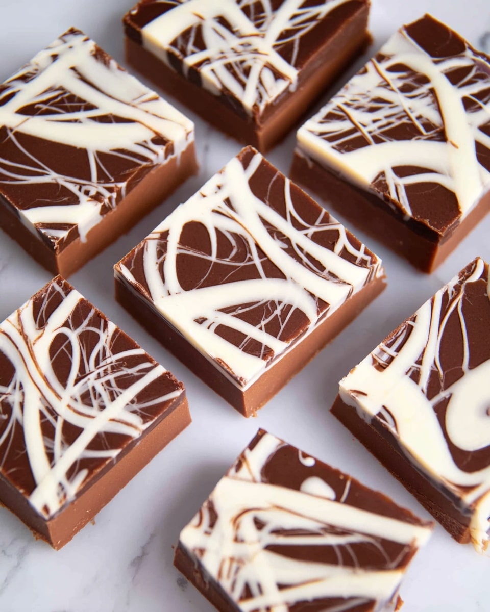 The image shows several square-shaped chocolate pieces arranged closely together on a white marbled surface. Each piece has two main layers: a thick bottom layer of smooth milk brown chocolate and a top layer of irregular white chocolate drizzle forming random swirls and lines over the surface. The edges of the chocolate squares are clean and sharp, giving a neat and tidy look. The white drizzle contrasts sharply with the darker milk chocolate below, providing a visually appealing pattern on each square photo taken with an iphone --ar 4:5 --v 7