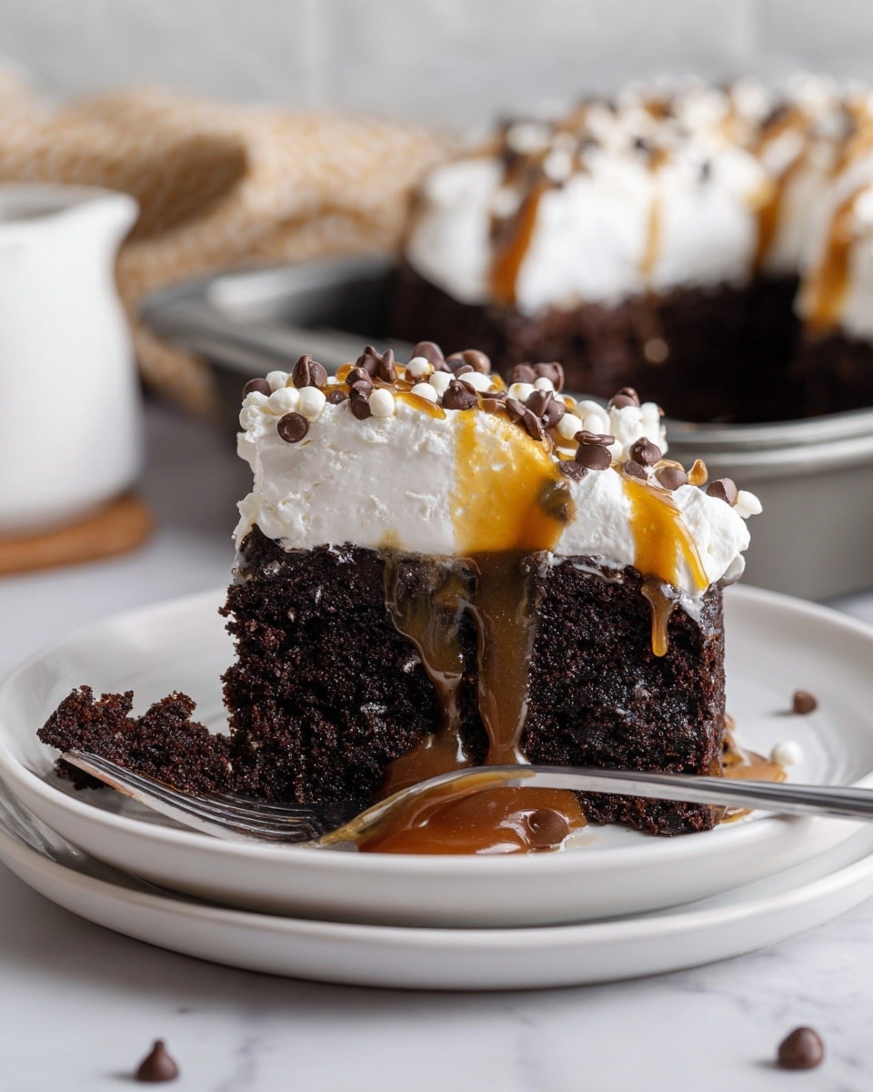 A thick slice of dark chocolate cake sits on a white plate, showing its moist and slightly crumbly texture with a glossy, sticky caramel sauce oozing from the middle and down the sides. On top, there is a generous layer of fluffy white whipped cream, drizzled with more caramel sauce and sprinkled with small light brown and dark chocolate chips. Next to the slice, a small piece of cake with whipped cream rests on the plate, and in the background, a baking pan filled with more cake topped with whipped cream and chocolate chips is visible on a white marbled surface. Photo taken with an iphone --ar 4:5 --v 7