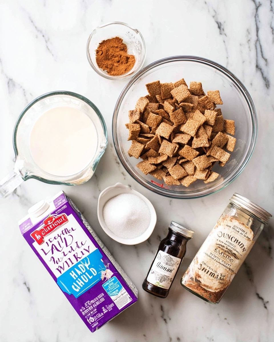 The image shows several ingredients placed on a white marbled surface. There is a glass bowl filled with square-shaped brown cereal pieces tossed with cinnamon. Next to it, a white measuring cup holds white granulated sugar. A dark brown bottle, a small jar of cinnamon with a beige label, and a carton of heavy whipping cream with red and blue text are arranged nearby. A purple and white carton of half and half cream sits on the left side, next to a glass measuring cup filled with white liquid. The setup looks clean and bright, ready for baking or cooking. photo taken with an iphone --ar 4:5 --v 7