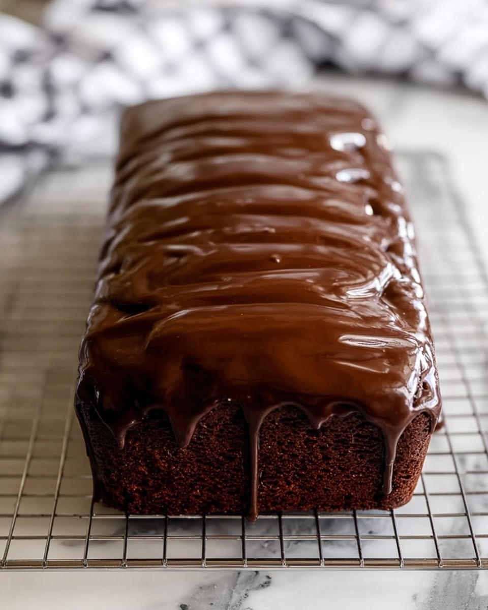 A rectangular chocolate cake covered in a thick, shiny, dark chocolate glaze that smooths over the top and drips slightly down the sides creating soft waves and ridges. The cake appears moist with a rich chocolate color visible underneath the glaze at the bottom edges. It sits on a cooling rack placed on a white marbled surface with a blurred background showing a checkered cloth pattern. The image shows one layer of cake fully covered in the glossy glaze, photo taken with an iphone --ar 4:5 --v 7