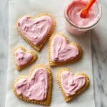 Heart Shaped Pastries with Strawberry or Cherry Jam and Colored Frosting Recipe