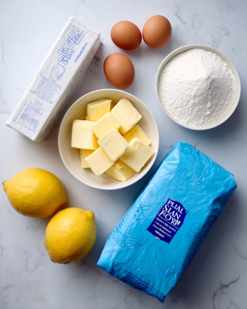 The image shows baking ingredients arranged neatly on a white marbled surface. There is a white carton of silver spoon icing sugar on the left, three brown eggs placed behind a small white bowl of soft yellow butter cubes, and two yellow lemons in front next to a white bowl filled with white granulated sugar. On the right, there is a large unopened blue packet of plain flour lying flat. The overall look is clean and organized with soft natural lighting. Photo taken with an iphone --ar 4:5 --v 7