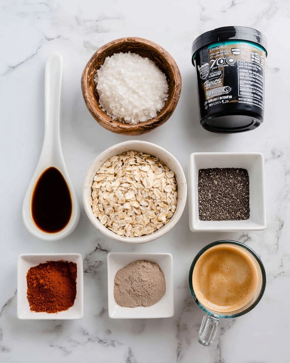A set of ingredients is shown on a white marbled surface: from left to right, a white ceramic spoon with dark brown liquid, a small round wooden bowl with white granules, a black container of vanilla yogurt with a label, a white bowl filled with light beige rolled oats, a glass measuring jug with a light creamy liquid, a white square dish with small black chia seeds, another white square dish with a reddish-brown powder, a white round bowl with a light brown powder clumped, and a clear glass cup with dark brown espresso topped with light foam. photo taken with an iphone --ar 4:5 --v 7