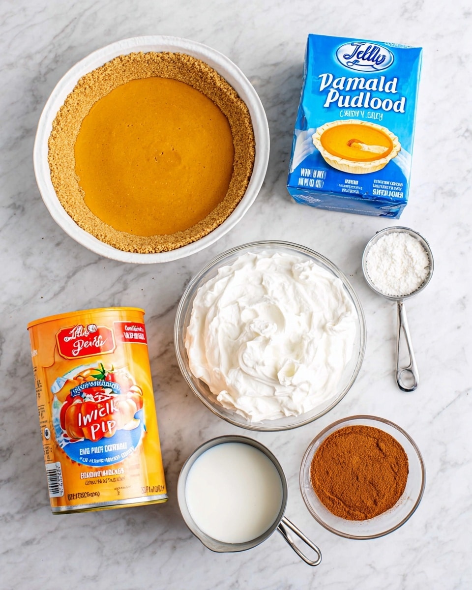 The image shows six ingredients arranged neatly on a white marbled surface, including a pre-packaged golden brown graham cracker pie crust in a white pan at the bottom left, a bright orange can of pumpkin with a pie picture on the label at the bottom right, a round white container of whipped topping lite with a blue label at the center right, a small white bowl filled with brown cinnamon powder near the top right, a silver measuring cup filled with white milk to the left of the whipped topping, and a blue and yellow box of JELL-O vanilla instant pudding at the top left. All items are evenly spaced with clean clear labels visible, photo taken with an iphone --ar 4:5 --v 7