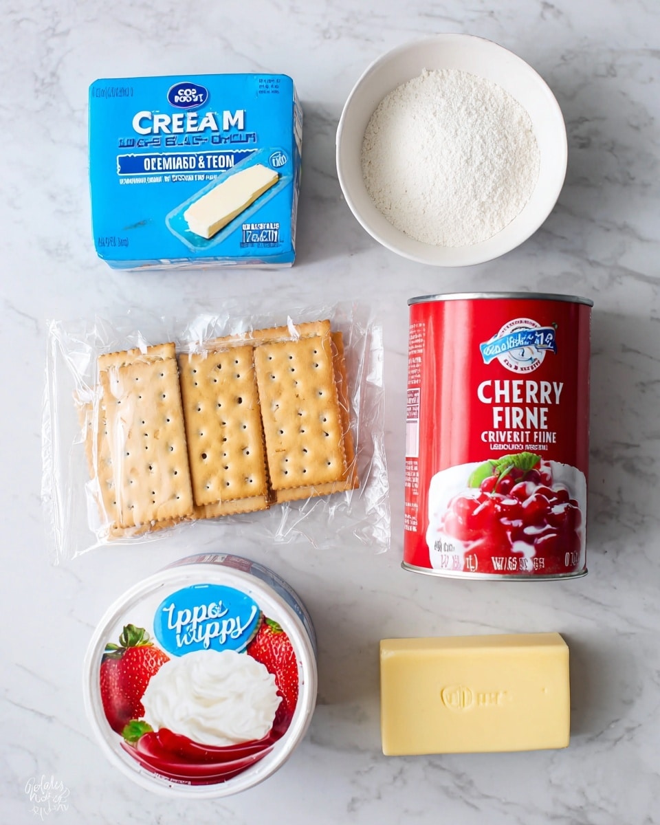 The image shows six baking ingredients arranged neatly on a white marbled surface: a blue box of cream cheese, a small white bowl filled with fine white powder, a clear plastic pack of rectangular graham crackers with small holes, a red can of cherry pie filling with a picture of cherry pie on it, a white round container of whipped topping with a blue label and images of strawberries, and a small stick of pale yellow butter with black text on the wrapper. Photo taken with an iphone --ar 4:5 --v 7