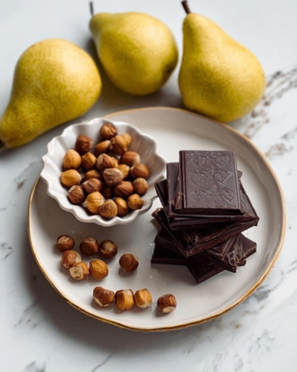 The image shows a white plate with several dark chocolate pieces stacked flat on it. To the left of the chocolate, there is a small white scalloped bowl filled with round hazelnuts. Surrounding the plate are three yellow pears. The entire setup is placed on a white marbled surface. The photo taken with an iphone --ar 4:5 --v 7