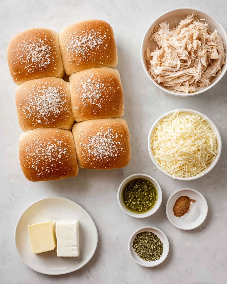 A group of twelve soft, light brown dinner rolls with a white powder on top is arranged close together in a 3x4 square on a white marbled surface. To the upper right, there is a white bowl filled with shredded light beige chicken. Below it, a white bowl contains finely shredded pale yellow cheese. Near the bowls are small white dishes with different ingredients: to the top right, a small white dish holds a square piece of pale yellow butter; below it to the center, a greenish sauce or pesto sits in a small bowl; below that are two more small dishes, one with fine light brown powder and another with dried green herbs. At the bottom center, a small white plate holds a square of soft white cream cheese. The scene is lit softly, with all items neatly spaced on the white marbled texture photo taken with an iphone --ar 4:5 --v 7
