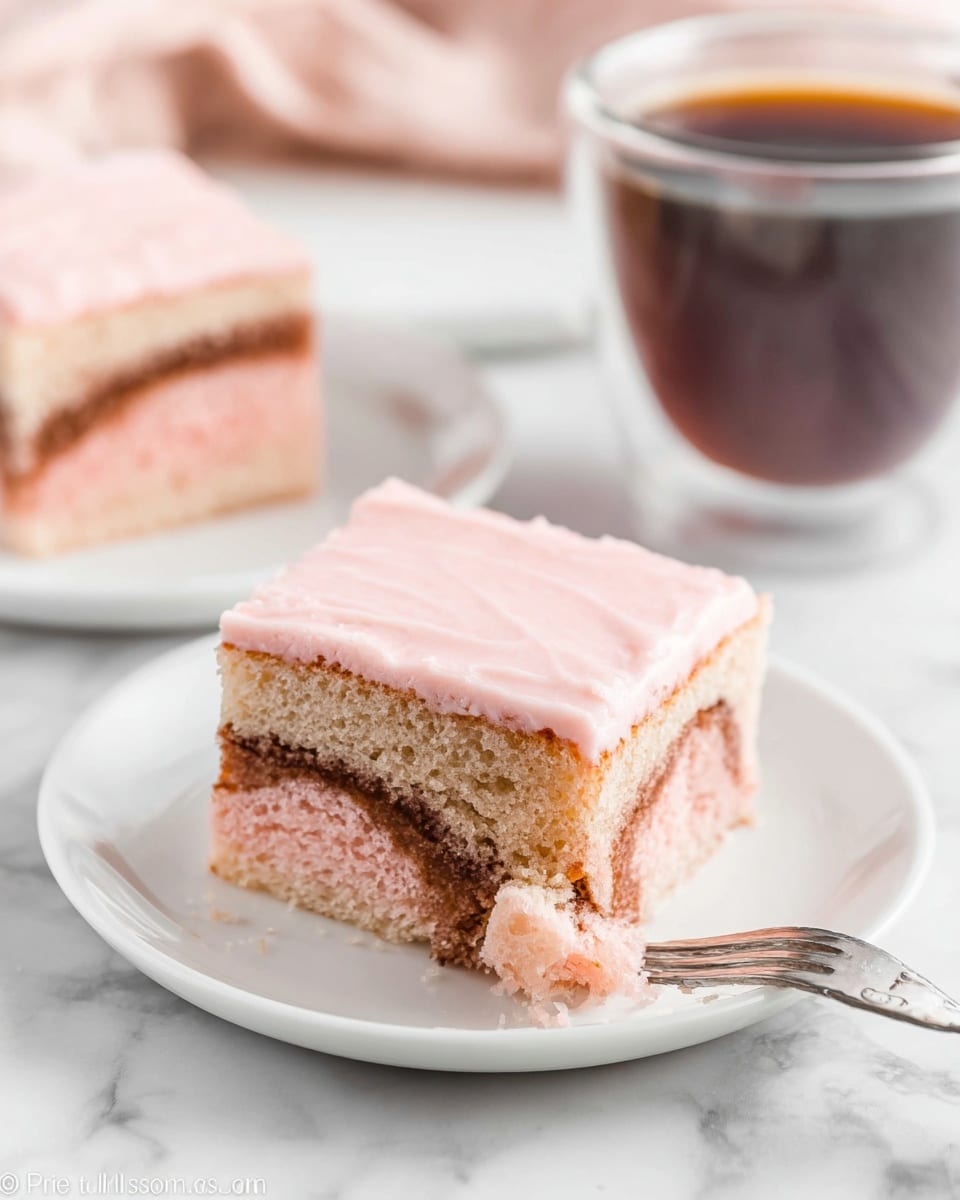 The image shows a square slice of cake on a white plate placed on a white marbled surface. The cake has three visible layers: the top layer is smooth and light pink frosting, the middle layer is a moist, light pink cake with some darker brown swirls or spots, and the bottom layer is similar to the middle but slightly darker with some browning. A piece of the cake, showing the pink cake texture with brown streaks, is lifted on a fork in front of the slice. In the background, there is another slice of the same cake on a white plate and a clear glass cup filled with dark coffee. photo taken with an iphone --ar 4:5 --v 7