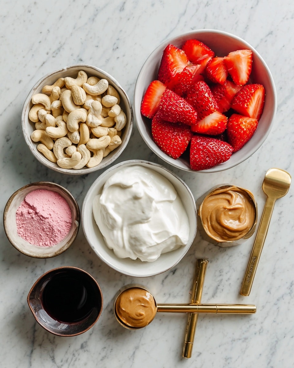 The image shows a top view of several small white bowls and measuring cups arranged on a white marbled surface. One larger bowl holds bright red halved strawberries, showing their juicy texture. Another white bowl is filled with light brown cashew nuts, smooth and curved in shape. There is a bowl with thick white yogurt or cream, fluffy in texture. A gold-handled measuring cup holds creamy peanut butter, smooth and light brown. Nearby, a smaller white bowl contains bright pink powder with a fine texture. There is a small dark brown cup filled with thick black liquid, and a gold-handled measuring spoon with a small amount of dark liquid. The arrangement is neat and all bowls and cups have wooden or gold handles, placed on a clean white marbled background. photo taken with an iphone --ar 4:5 --v 7