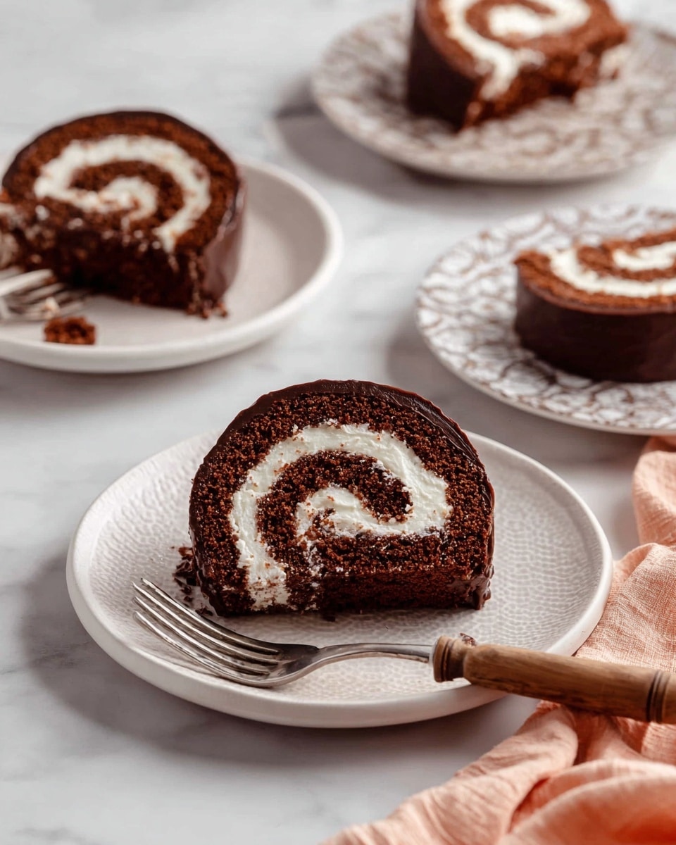 The image shows a chocolate roll cake slice on a white plate with a textured rim, surrounded by three other similar slices on white plates with different patterns. Each cake slice has two main layers: a dark brown chocolate sponge cake layer rolled with a white creamy filling forming a spiral. The outside is coated with a smooth dark chocolate layer. On the closest plate, a silver fork with a wooden handle holds a small piece of the cake. The background has a white marbled texture with a soft peach cloth in the corner. The light is soft, highlighting the textures and colors of the cake. photo taken with an iphone --ar 4:5 --v 7