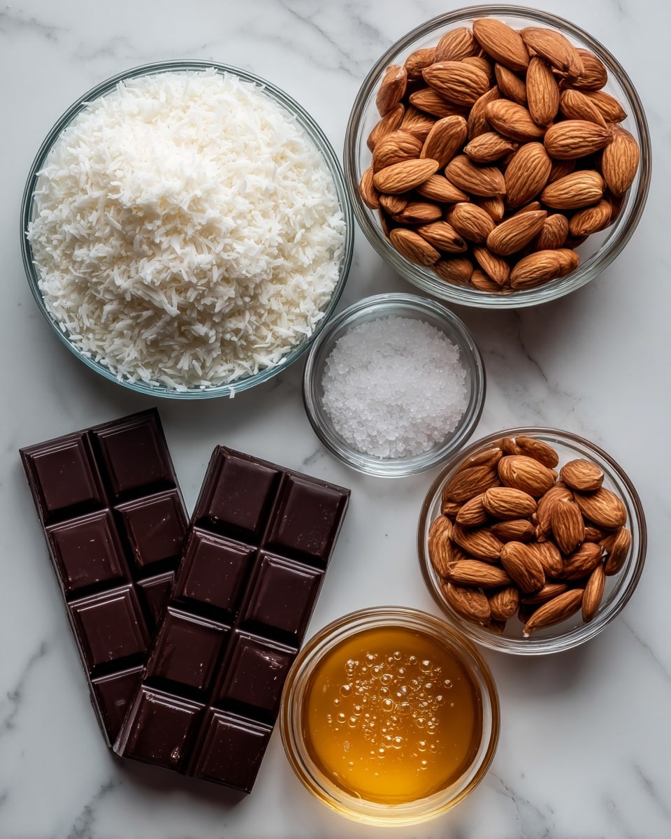 The image shows five clear glass bowls and two dark chocolate bars arranged on a white marbled surface. The largest bowl in the center holds a fluffy white shredded coconut, its texture light and airy. To the top right is a bowl filled with light brown raw almonds, smooth and slightly shiny. At the top center, a smaller bowl contains coarse sea salt, visible as small white crystals. To the bottom right, a small bowl holds golden honey with bubbles on the surface, its thick and sticky texture visible. The two dark chocolate bars, placed on the left side, have a glossy surface and neat rectangular sections. photo taken with an iphone --ar 4:5 --v 7