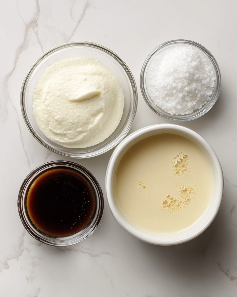 The image shows four glass and white bowls arranged on a white marbled surface. The largest glass bowl on the left holds a smooth thick white mixture. Above it, a small clear glass bowl contains coarse white salt crystals. To the right, a medium white bowl is filled with a creamy, pale yellow liquid with some small bubbles on the surface. Below that, a small clear glass bowl has a dark brown, smooth liquid inside. All bowls are clean and the scene has a soft, bright light. Photo taken with an iphone --ar 4:5 --v 7