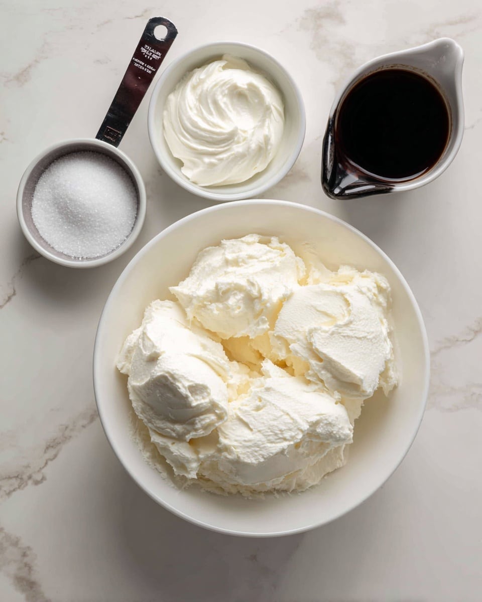 A white bowl in the center filled with soft, white cream cheese, showing its smooth and thick texture in several dollops. Around this bowl are three measuring cups: one contains granulated white sugar, another holds thick white cream, and the third smaller cup is empty. A dark container laying on its side with a dark label is near the top of the main bowl. All items are placed on a white marbled surface. Photo taken with an iphone --ar 4:5 --v 7