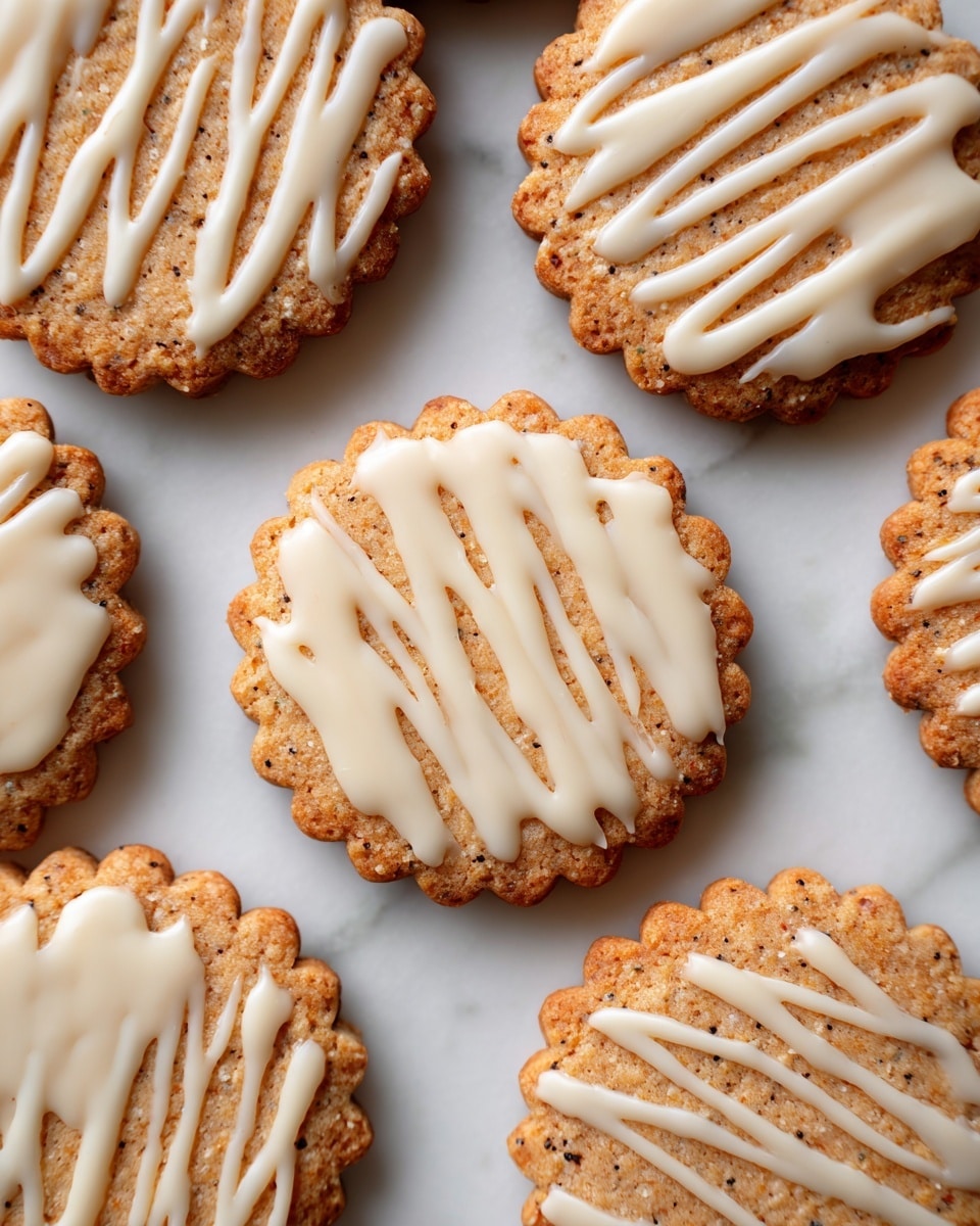 The image shows several round cookies with scalloped edges placed on a white marbled surface. Each cookie has a golden-brown color with small darker spots, showing a slightly rough texture. Drizzled on top of each cookie is a thin layer of smooth white icing arranged in thin and thick diagonal lines. The cookies are scattered but evenly spaced, filling the frame. Photo taken with an iphone --ar 4:5 --v 7