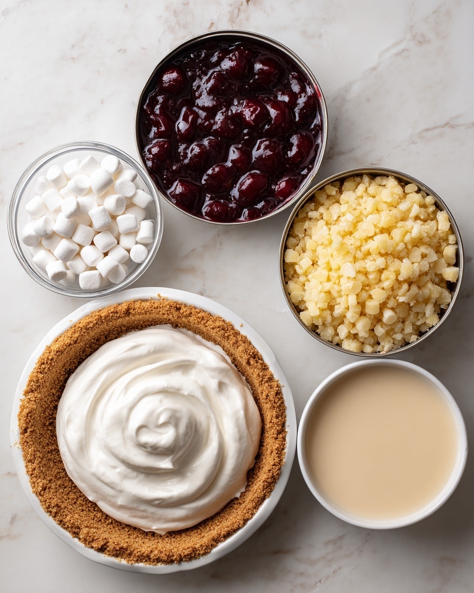 The image shows six ingredients on a white marbled surface arranged neatly. At the top left, there is an open can filled with dark red cherry pie filling, displaying a shiny, thick texture. Next to it on the top right is another open can with light yellow crushed pineapple, which looks soft and slightly wet. Below these, on the left side, a small clear glass bowl holds white mini marshmallows, smooth and round. In the center, a white bowl contains creamy, smooth whipped topping with soft peaks and swirls on its surface. To the right of it is an open can filled with pale, beige sweetened condensed milk, smooth and glossy. At the bottom of the image, a 9-inch white pie pan with a golden-brown graham cracker crust with a crumbly texture completes the setup. photo taken with an iphone --ar 4:5 --v 7